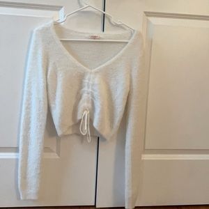 white cropped long sleeve center cinched top